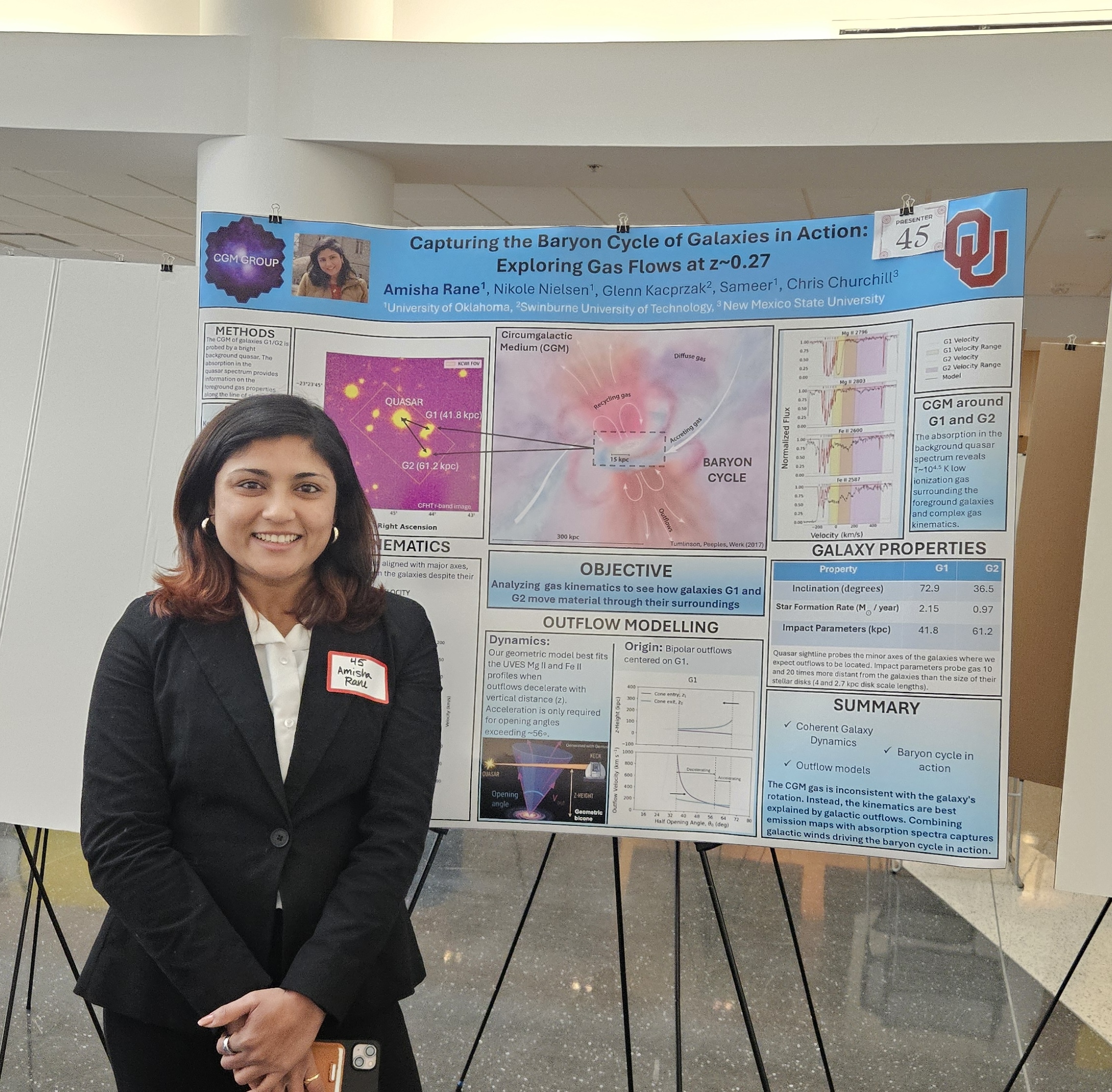 Amisha standing in front of her poster